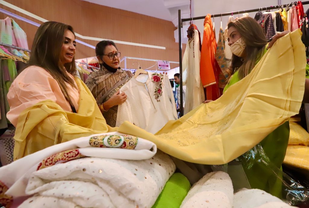 A visitor checks out designer wear at 'Global Fashion Summer Stlylists' exhibition, which has started in Himachal Bhawan, Chandigarh.